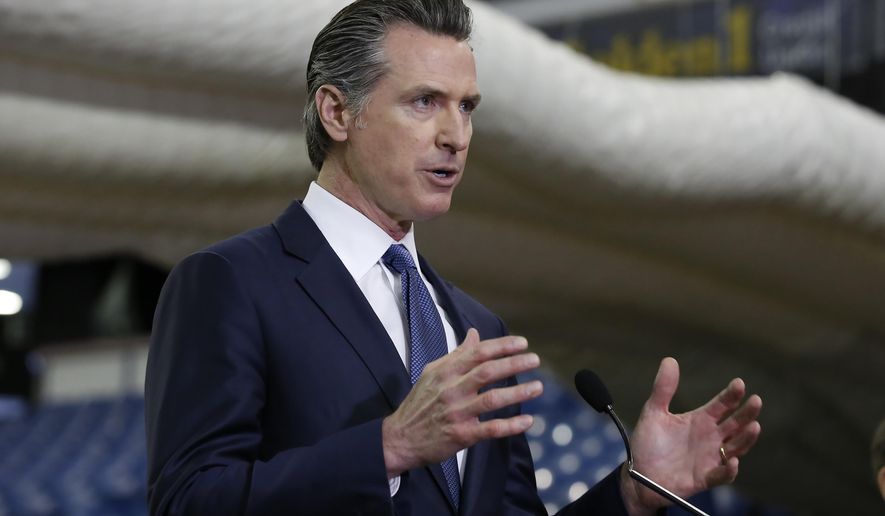 FILE — In this Monday April 6, 2020 file photo, Gov. Gavin Newsom discusses the acquisition of the Sleep Train Arena for use as a field hospital, after touring the facility, in Sacramento, Calif., Newsom announced, Tuesday, April 7, 2020 the state will spend nearly $1 billion to purchase up to 200 million masks per month to boost the state's stockpile of protective equipment during the COVID-19 outbreak and provide as a supplier to other western states. (AP Photo/ (AP Photo/Rich Pedroncelli, Pool, File)