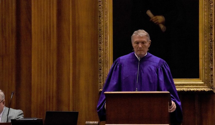Senate President Harvey Peeler presides over the state Senate during a special, one-day session of the South Carolina Legislature on Wednesday, April 8, 2020, in Columbia, S.C. This year's session has been paused for several weeks amid the new coronavirus outbreak. (AP Photo/Meg Kinnard)