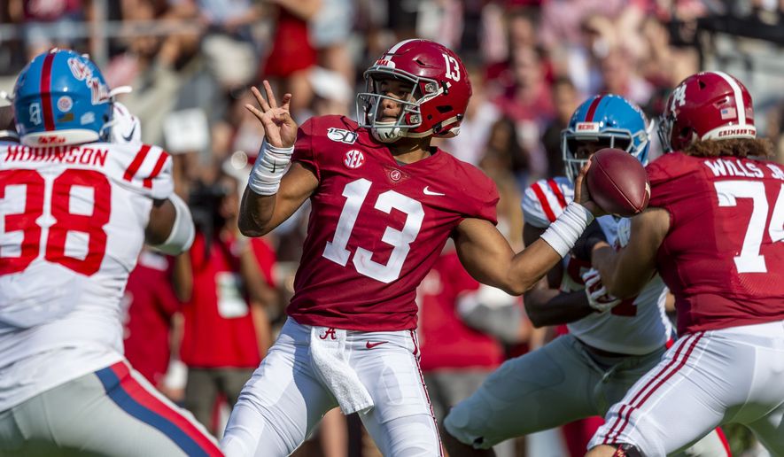 FILE - In this Sept. 28, 2019, file photo, Alabama quarterback Tua Tagovailoa (13) throws a pass during the first half of the team's NCAA college football game against Mississippi in Tuscaloosa, Ala. Tagovailoa’s agent says the quarterback is healthy and will be ready for training camp. Tagovailoa held a virtual pro day with former NFL quarterback Trent Dilfer on Thursday, April 9, after the former Alabama star’s personal pro day was canceled because of the coronavirus outbreak. Tagovailoa injured his hip on Nov. 15 and had season-ending surgery two days later. He is expected to be among the top five picks in the NFL draft later this month. (AP Photo/Vasha Hunt, File)