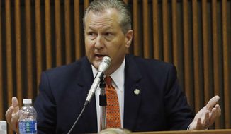 FILE - This June 9, 2016 file photo shows Alabama House Speaker Mike Hubbard answering questions from Deputy Attorney General Matt Hart during his trial in Opelika, Ala.  The Alabama Supreme Court on Friday, April 10, 2020, overturned five of the ethics convictions that ended the political career of former House Speaker Mike Hubbard, while upholding six others.  (Todd J. Van Emst/Opelika-Auburn News via AP, Pool, file)