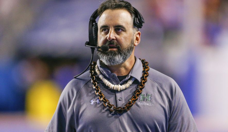 FILE - In this Saturday, Oct. 12, 2019, file photo, Hawaii head coach Nick Rolovich walks the sideline during the second half of an NCAA college football game against Boise State, in Boise, Idaho. Nick Rolovich dived right in when Washington State hired him in January. Just when it seemed like things were up and rolling, the COVID-19 pandemic hit. The national shutdown hurt coaches across college football as they prepare for the 2020-21 season, but it was particularly difficult on programs with first-year coaches trying to build something new from the ground up. (AP Photo/Steve Conner, File)