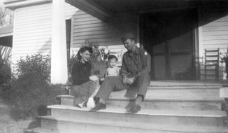 In this image provided by the McConnell Center at the University of Louisville, Mitch McConnell sits with his parents, Julia &amp;quot;Dean&amp;quot; and A.M. McConnell in this image from the mid 1940&#39;s in Five Points, Ala. As the coronavirus pandemic unfolds, Senate Majority Leader Mitch McConnell flashes back to an earlier crisis that gripped the nation, and his own life, when he was a boy. He was struck with polio. (McConnell Center at the University of Louisville via AP)