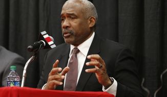 FILE - In this Dec. 4, 2018, file photo, Ohio State athletics director Gene Smith answers questions during a news conference in Columbus, Ohio. Ohio State athletic director Gene Smith said the discussion is just beginning on prepare-to-play issues after most programs had spring football practice shortened or wiped out and had to deal with all of their spring sports being called to a halt. (AP Photo/Jay LaPrete, File)