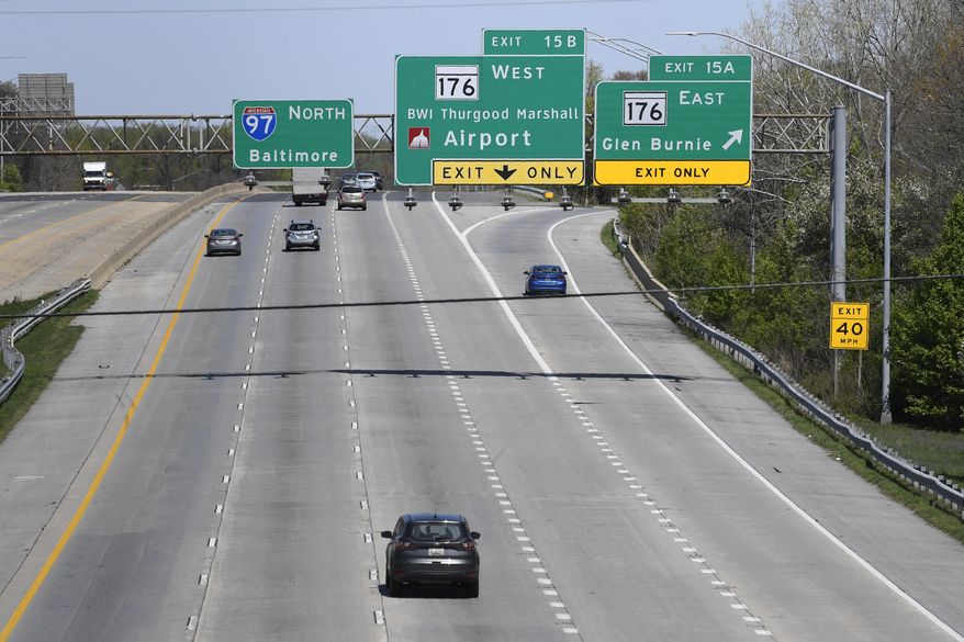 Cars travel along Interstate 97 in Glen Burnie, Md., Monday, April 6, 2020. America’s roads are a lot less congested, due to coronavirus shutdowns that have kept millions of commuters, shoppers and vacationers parked at their homes. While that makes it easier to patch potholes, it also could spell trouble for road and bridge projects, as revenue from tolls, fuel taxes and other user fees declines. (AP Photo/Susan Walsh)