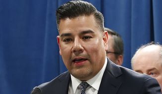 In this Tuesday, Feb. 18, 2020 file photo is California Insurance Commissioner Ricardo Lara at a state Capitol news conference in Sacramento, Calif. On Monday, April 13, 2020, Lara ordered some companies to refund insurance premiums for March and April because of the coronavirus. The directive includes workers compensation, medical malpractice and private and commercial auto policies. (AP Photo/Rich Pedroncelli, File)