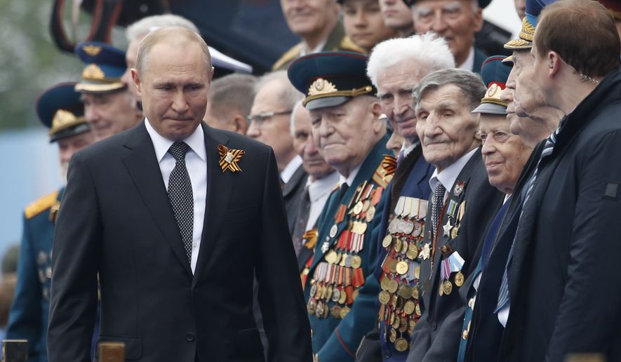 In this Thursday, May 9, 2019, file photo, Russian President Vladimir Putin walks to attend a military parade marking 74 years since the victory in WWII in Red Square in Moscow, Russia. (AP Photo/Alexander Zemlianichenko, File)