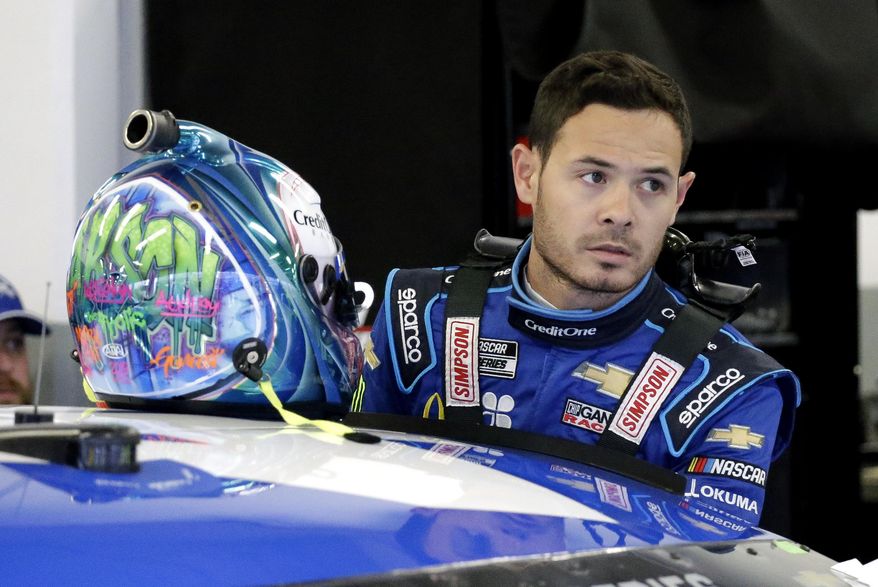In this Feb. 14, 2020, file photo, Kyle Larson gets ready to climb into his car to practice for the NASCAR Daytona 500 auto race at Daytona International Speedway in Daytona Beach, Fla. Kyle Larson used a racial slur on a live stream Sunday. April 12, 2020, during a virtual race — the second driver in a week to draw scrutiny while using the online racing platform to fill time during the coronavirus pandemic.(AP Photo/Terry Renna, File)  **FILE**