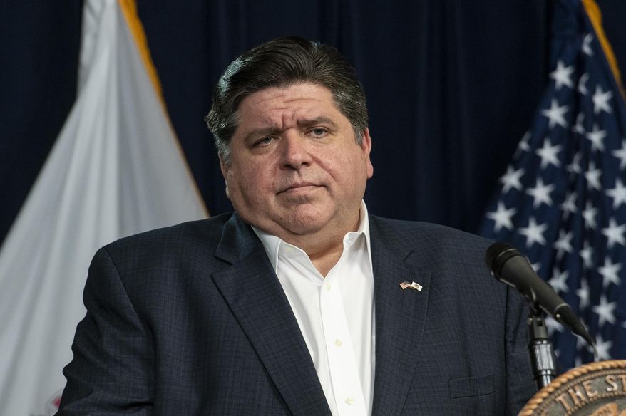 Illinois Gov. J.B. Pritzker, along with other health officials, gives a daily update on the coronavirus outbreak in Illinois, Monday, April 13, 2020, in Chicago. (Tyler LaRiviere/Chicago Sun-Times via AP)