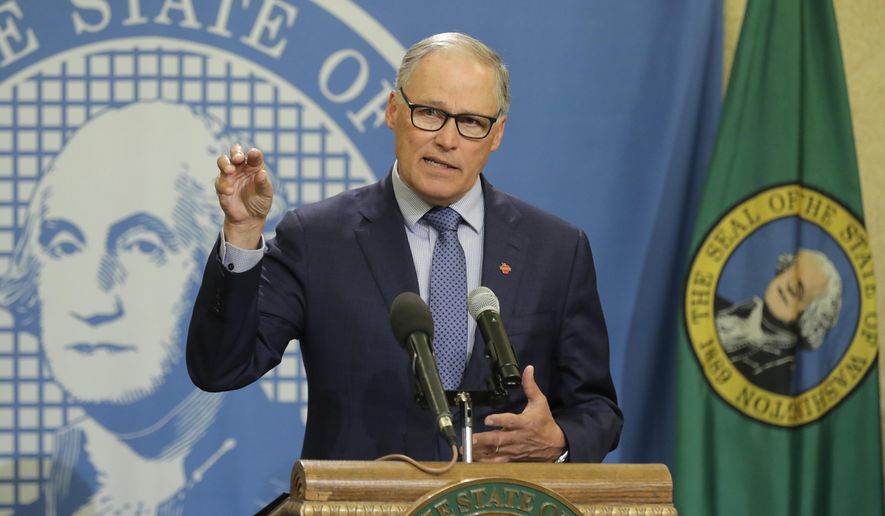 Washington Gov. Jay Inslee speaks during a news conference Monday, April 13, 2020, at the Capitol in Olympia, Wash. Inslee, along with California Gov. Gavin Newsom and Oregon Gov. Kate Brown, announced Monday that they will work together to re-open their economies while continuing to control the spread of COVID-19. (AP Photo/Ted S. Warren)