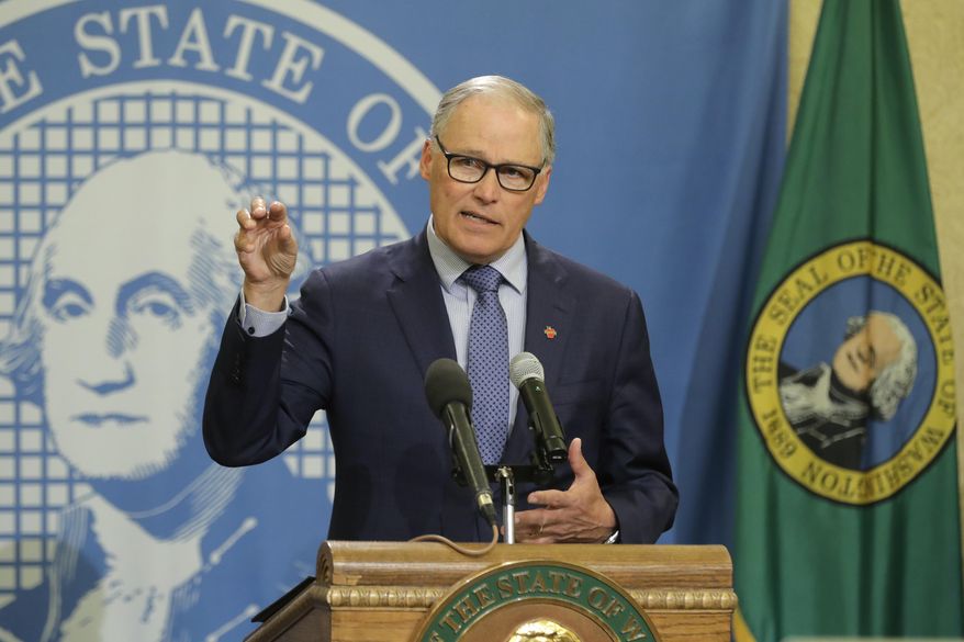 Washington Gov. Jay Inslee speaks during a news conference Monday, April 13, 2020, at the Capitol in Olympia, Wash. Inslee, along with California Gov. Gavin Newsom and Oregon Gov. Kate Brown, announced Monday that they will work together to re-open their economies while continuing to control the spread of COVID-19. (AP Photo/Ted S. Warren)