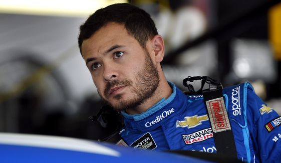 In this July 27, 2019, file photo, Kyle Larson climbs into his car for a practice session for the NASCAR Cup Series auto race in Long Pond, Pa. Kyle Larson was fired Tuesday, April 14, 2020, by Chip Ganassi Racing, a day after nearly every one of his sponsors dropped the star driver for using a racial slur during a live stream of a virtual race. Larson, in his seventh Cup season with Ganassi and considered the top free agent in NASCAR mere weeks ago, is now stunningly out of a job in what could ultimately be an eight-figure blunder by the star.  (AP Photo/Derik Hamilton, File)