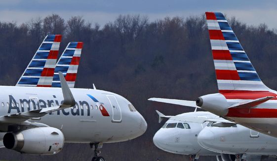 In this Tuesday, March 31, 2020, file photo, these are some of the 88 American Airlines planes stored at Pittsburgh International Airport in Imperial, Pa. (AP Photo/Gene J. Puskar, File)