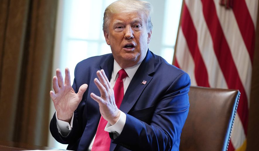 President Donald Trump speaks during a meeting with people that have recovered from COVID-19, in the Cabinet Room of the White House, Tuesday, April 14, 2020, in Washington. (AP Photo/Evan Vucci)