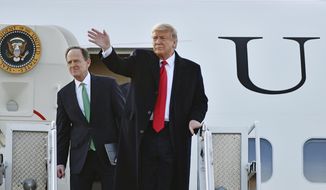 President Trump greets his supporters with U.S. Sen. Pat Toomey (R-PA) after arriving at Wilkes-Barre/Scranton International Airport in Avoca, Pa. Thursday, March 5, 2020. (Sean McKeag/The Citizens&#39; Voice via AP)