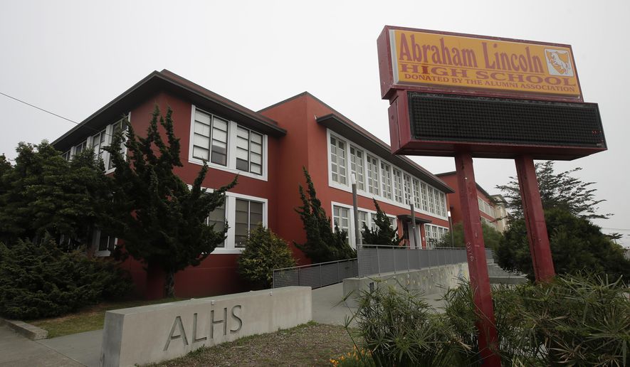 FILE - This Thursday, March 12, 2020 shows Abraham Lincoln High School in San Francisco. Staggered start times. Classes cut in half. Social distancing in the hallways and cafeteria. Classes on, then off again. These are just a few of the possible scenarios for California schools after California Gov. Gavin Newsom laid out a roadmap for reopening the state amid the coronavirus outbreak. (AP Photo/Jeff Chiu,File)