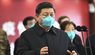 In this Tuesday, March 10, 2020, photo released by China&#39;s Xinhua News Agency, Chinese President Xi Jinping talks by video with patients and medical workers at the Huoshenshan Hospital in Wuhan in central China&#39;s Hubei Province. Top Chinese officials secretly determined they were likely facing a pandemic from a novel coronavirus in mid-January, ordering preparations even as they downplayed it in public. Internal documents obtained by the AP show that because warnings were muffled inside China, it took a confirmed case in Thailand to jolt Beijing into recognizing the possible pandemic before them. (Xie Huanchi/Xinhua via AP)