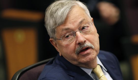 In this March 4, 2019, file photo, U.S. Ambassador to China Terry Branstad listens to Secretary of State Mike Pompeo speak at an event in Johnston, Iowa. The U.S. ambassador to China said Wednesday, April 15, 2020, that he doesn&#39;t believe Beijing is deliberately blocking exports of personal protective equipment and medical supplies, adding that the shipment of 1,200 tons of such products to the U.S. could not have been possible without Chinese support. (AP Photo/Charlie Neibergall, File)