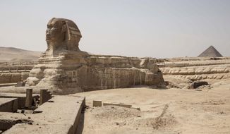 This March 25, 2020 photo, shows the empty Sphinx complex of the Giza Pyramids in Egypt. &amp;quot;Everything collapsed in a flash,&amp;quot; said Sayed el-Gabri, a souvenir vendor, as he stared at the almost empty complex of Egypt&#x27;s famed Giza Pyramids. It was not unexpected, but the evaporation of the stream of visitors to the ancient site was still a shock to el-Gabri and other tourism workers. He saw it coming, as the government stepped up its measures to slow the new coronavirus&#x27; spread, culminating in a ban on all international flights in and out of the country. (AP Photo/Nariman El-Mofty)