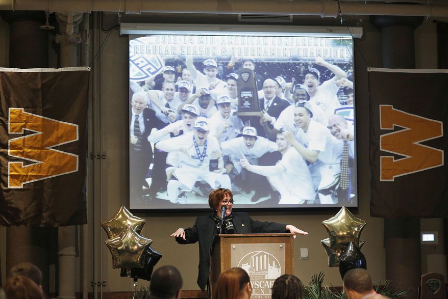 FILE - In this March 16, 2014, file photo, Western Michigan's Athletic Director Kathy Beauregard makes a speech to honor the men's basketball team's effort this season before Selection Sunday at Cityscape Events Center in Kalamazoo, Mich. The coronavirus pandemic didn't just wipe out the NCAA Tournament games when it hit college basketball. The coaching carousel is also on hold. Before long, WMU athletic director Kathy Beauregard was dealing with restrictions on travel and external hires, and it was obvious this would not be a normal coaching search. (Junfu Han/Kalamazoo Gazette via AP)