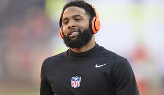FILE - In this Dec. 22, 2019, file photo, Cleveland Browns wide receiver Odell Beckham Jr. is shown before an NFL football game against the Baltimore Ravens, in Cleveland. Browns chief strategy officer Paul DePodesta dismissed a report the team is trying to trade star wide receiver Odell Beckham Jr., whose future _ whether in New York or Cleveland or anywhere _ always seems in question. DePodesta said on a conference call Thursday, April 16, 2020,  from his home in California that the team is not working on a deal involving Beckham, who was injured during his first season with the Browns after arriving in a blockbuster trade last March. On Wednesday, a report said the Browns were in talks with the Minnesota Vikings about the 27-year-old Beckham. (AP Photo/David Richard, File)