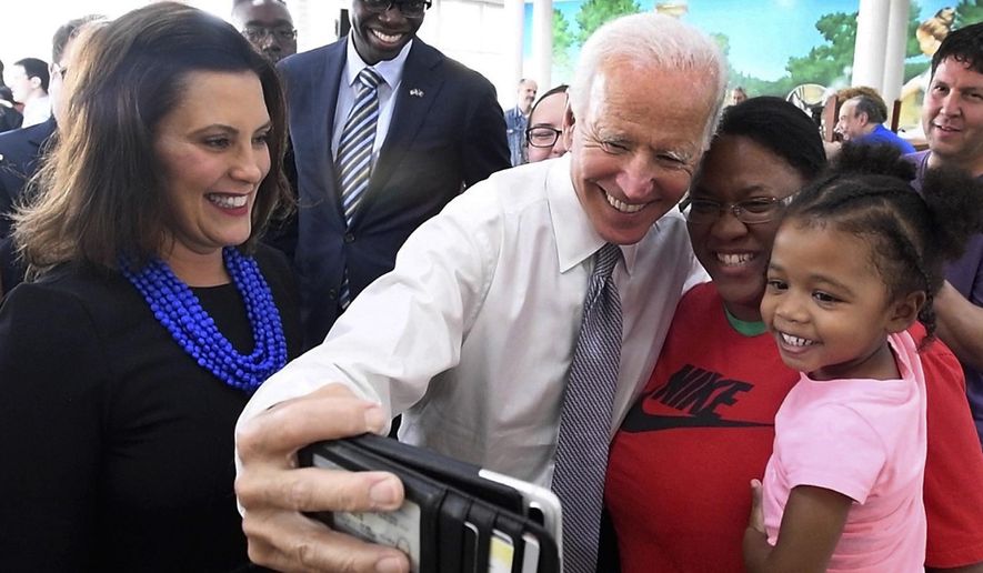 In this Sept. 12, 2018, Former Vice President Joe Biden takes a photo with Samantha Green and daughter Ava Green during a visit with Michigan Democratic gubernatorial candidate Gretchen Whitmer, left, and running mate Garland Gilchrist to Leo&#39;s Coney Island in Southfield, Mich. As presumptive Democratic presidential nominee Joe Biden begins the process of choosing a running mate amid the coronavirus crisis, managing the pandemic has become its own version of an audition. For potential picks, lobbying for the job means breaking into the national conversation, positioning themselves as leaders and executing at their day job. (Daniel Mears/Detroit News via AP) **FILE**