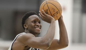 FILE - In this Jan. 28, 2020, file photo, Indiana Pacers&#39; Victor Oladipo shoots during practice at the team&#39;s NBA basketball training facility in Indianapolis.  Oladipo was rounding into form when the NBA suddenly stopped. His expected increase in playing time, his hopes of chasing a home playoff series and taking the Indiana Pacers on a deep postseason run went on hold — at least a few more weeks. (AP Photo/Darron Cummings, File)