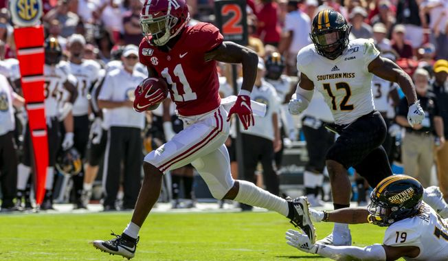 FILE - In this Sept. 21, 2019, file photo, Alabama wide receiver Henry Ruggs (11) runs in for a touchdown on a pass reception against Southern Mississippi during the first half of an NCAA college football game in Tuscaloosa, Ala.  The Raiders have the 12th and 19th picks in the NFL draft thanks to the 2018 trade that sent star pass rusher Khalil Mack to the Chicago Bears. Several receivers are projected to go in the first round. Ruggs and Oklahoma&#x27;s CeeDee Lamb are considered by many analysts to be the best of the bunch. (AP Photo/Vasha Hunt, File)