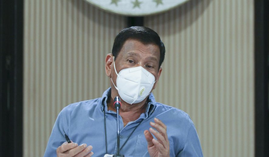 In this April 8, 2020, handout photo provided today by the Malacanang Presidential Photographers Division, Philippine President Rodrigo Duterte wears a protective mask as he speaks on the new coronavirus situation of the country during a late night live broadcast from Malacanang, Manila, Philippines. The new coronavirus causes mild or moderate symptoms for most people, but for some, especially older adults and people with existing health problems, it can cause more severe illness or death. (Toto Lozano, Malacanang Presidential Photographers Division via AP)