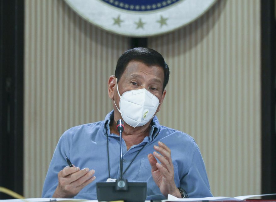 In this April 8, 2020, handout photo provided today by the Malacanang Presidential Photographers Division, Philippine President Rodrigo Duterte wears a protective mask as he speaks on the new coronavirus situation of the country during a late night live broadcast from Malacanang, Manila, Philippines. The new coronavirus causes mild or moderate symptoms for most people, but for some, especially older adults and people with existing health problems, it can cause more severe illness or death. (Toto Lozano, Malacanang Presidential Photographers Division via AP)