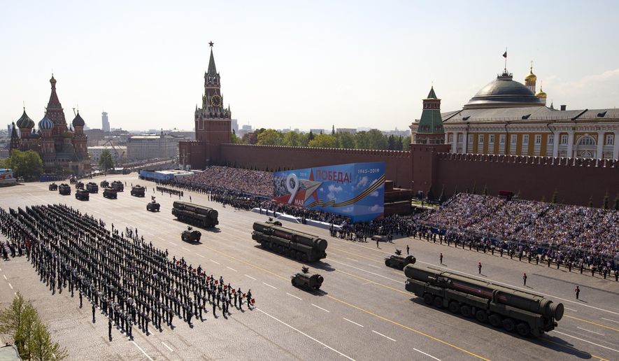 In this file photo taken on Tuesday, May 7, 2019, Russian military vehicles roll down Red Square during a rehearsal for the Victory Day military parade in Moscow, Russia. (AP Photo/Alexander Zemlianichenko, Pool, File) **FILE**