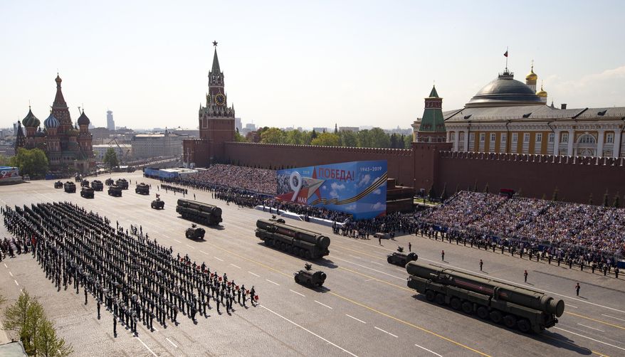 In this file photo taken on Tuesday, May 7, 2019, Russian military vehicles roll down Red Square during a rehearsal for the Victory Day military parade in Moscow, Russia. (AP Photo/Alexander Zemlianichenko, Pool, File) **FILE**