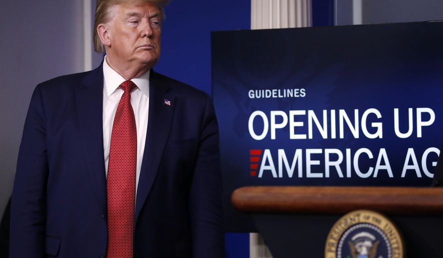President Donald Trump listens during a briefing about the coronavirus in the James Brady Press Briefing Room of the White House, Thursday, April 16, 2020, in Washington. (AP Photo/Alex Brandon)
