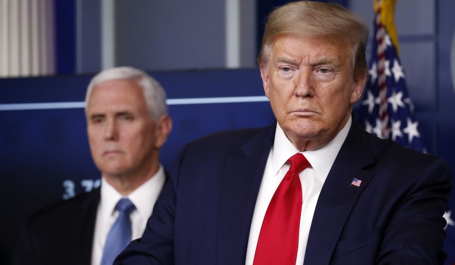 President Donald Trump speaks about the coronavirus in the James Brady Press Briefing Room of the White House, Friday, April 17, 2020, in Washington, as Vice President Mike Pence listens. (AP Photo/Alex Brandon)