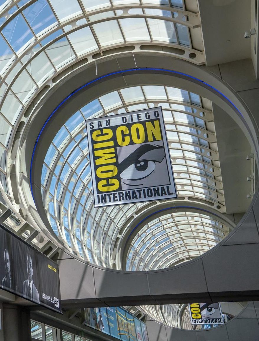 FILE - This July 20, 2018 file photo shows signage for Comic-Con International in San Diego. This year’s San Diego Comic-Con has been canceled due to coronavirus-related restrictions around large gatherings. Organizers say they are planning for the festival to return in July 2021. (Photo by Christy Radecic/Invision/AP, File)