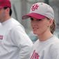 FILE - In this Wednesday, Feb. 28, 1995, file photo, University of Massachusetts assistant baseball coach Julie Croteau watches the team during practice in Amherst, Mass. At left is coach Mike Stone. Julie Croteau sometimes felt alone along her historic path as a female baseball player. That changed the day she set foot on the set of the Penny Marshall-directed movie “A League of Their Own.” The film checked in at No. 10 on The Associated Press best sports movies Top 25. (AP Photo/David Bruneau, File)