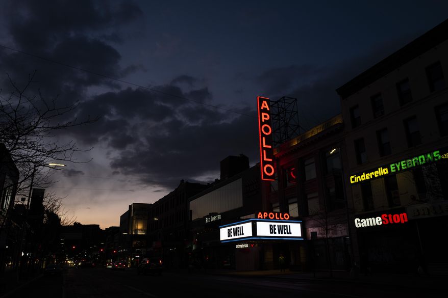 The Apollo Theater is closed due to the coronavirus pandemic but carries the message "Be Well," Thursday, April 16, 2020, in the Harlem neighborhood of New York. Many entertainment venues are closed nationwide during the pandemic. (AP Photo/Mark Lennihan)