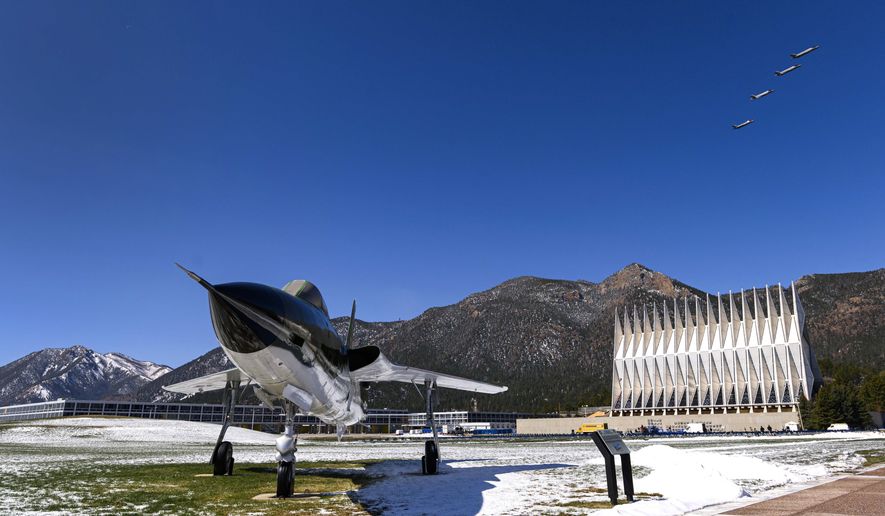 Four F-35A fighter jets fly over the Air Force Academy in Colorado Springs, Colo., Friday, April 17, 2020, to honor the Class of 2020 who will graduate early in a closed ceremony Saturday on the terrazzo at the center of campus rather than Falcon Stadium. The early graduation on the terrazzo will allow them to stay 8 feet apart during the COVID-19 pandemic. Vice President Mike Pence will speak in person, but the cadets won&#39;t march up to receive diplomas and high fives and hugs are banned. The Thunderbirds will fly over at the conclusion of the ceremony that will be streamed online for families and friends. In the foreground is a Republic F-105D Thunderchief, the first supersonic tactical fighter-bomber developed from scratch. The first F-105D Thunderchief flew in 1959 and played a major role in the Vietnam War. (Christian Murdock/The Gazette via AP)