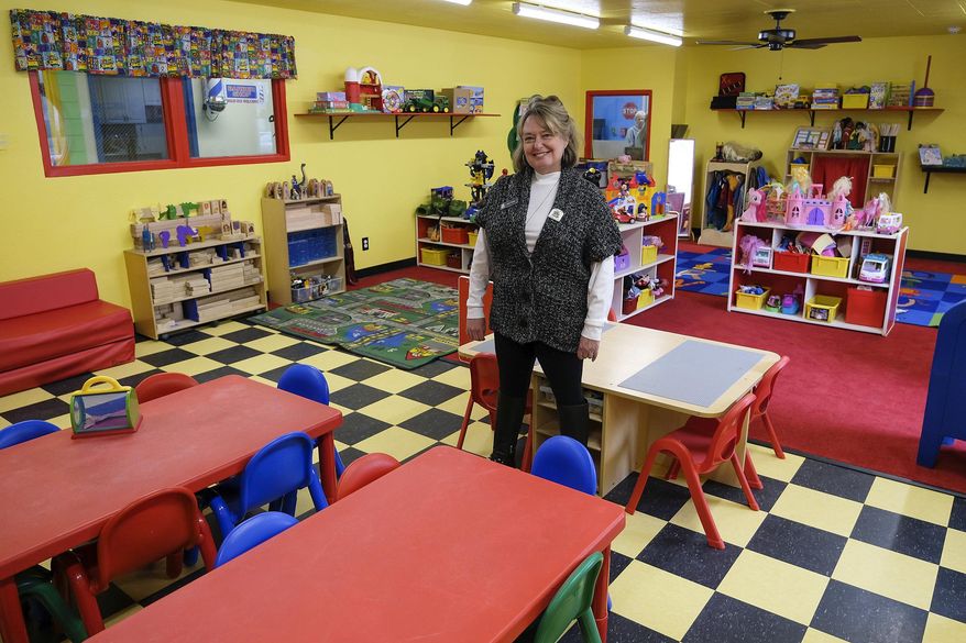 In this Jan. 30, 2020 photo, Robin Moore stands in the pre-K room of the new Robin's Nest Learning Center in Carbondale, Ill. Robin's Nest is a licensed emergency provider of childcare. (Byron Hetzler/The Southern Illinoisan via AP)