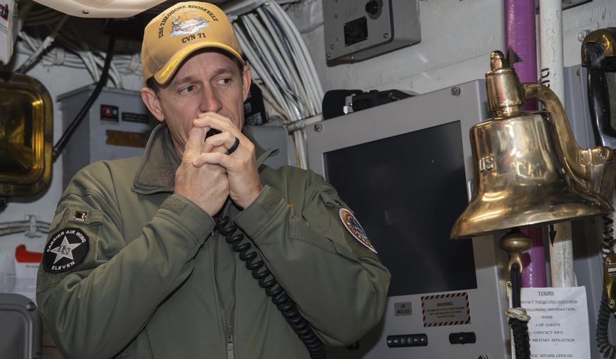 In this image provided by the U.S. Navy, Capt. Brett Crozier, then-commanding officer of the aircraft carrier USS Theodore Roosevelt (CVN 71), addresses the crew on Jan. 17, 2020, in San Diego, Calif. The Navy’s top admiral will soon decide the fate of the ship captain who was fired after pleading for his superiors to move faster to safeguard his coronavirus-infected crew on the USS Theodore Roosevelt.  (Mass Communication Specialist Seaman Alexander Williams/U.S. Navy via AP)