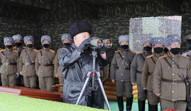 FILE - In this Feb. 28, 2020, file photo provided by the North Korean government, North Korean leader Kim Jong Un, center, inspects the military drill of units of the Korean People&#x27;s Army, with soldiers shown wearing face masks. North Korea says it has zero coronavirus infections, but experts doubt it and say it’s likely the virus has already spread in the country. Independent journalists were not given access to cover the event depicted in this image distributed by the North Korean government. The content of this image is as provided and cannot be independently verified. Korean language watermark on image as provided by source reads: &amp;quot;KCNA&amp;quot; which is the abbreviation for Korean Central News Agency. (Korean Central News Agency/Korea News Service via AP, File)