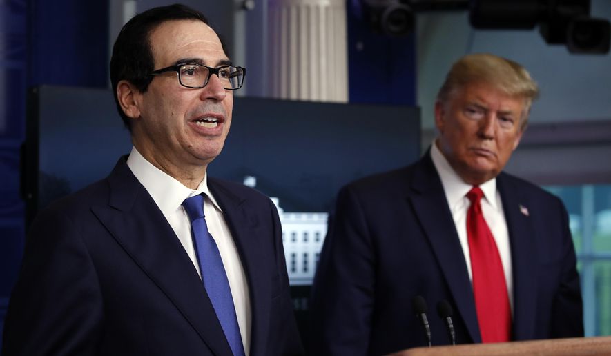 In this April 13, 2020, file photo President Donald Trump listens as Treasury Secretary Steven Mnuchin speaks about the coronavirus in the James Brady Press Briefing Room at the White House in Washington. The Trump administration and Congress are nearing an agreement as early as Sunday, April 19, on a $400-plus billion aid package to boost a small-business loan program that has run out of money and add funds for hospitals and COVID-19 testing. (AP Photo/Alex Brandon) **FILE**