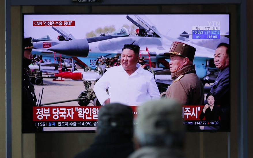 People watch a TV screen showing a news program reporting about North Korean leader Kim Jong-un with a file image at the Seoul Railway Station in Seoul, South Korea, Tuesday, April 21, 2020. The South Korean government is looking into unconfirmed reports saying North Korean leader Kim is in fragile condition after surgery. (AP Photo/Lee Jin-man)