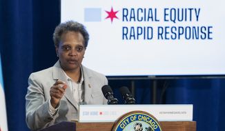 Mayor Lori Lightfoot answers a reporter&#39;s question during a news conference to provide an update to the latest efforts by the Racial Equity Rapid Response Team in Chicago on Monday, April 20, 2020. (Tyler LaRiviere/Chicago Sun-Times via AP)