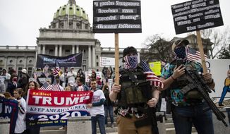 Protesters demonstrate at the state Capitol in Harrisburg, Pa., Monday, April 20, 2020, demanding that Gov. Tom Wolf reopen Pennsylvania's economy even as new social-distancing mandates took effect at stores and other commercial buildings. (AP Photo/Matt Rourke) FILE 