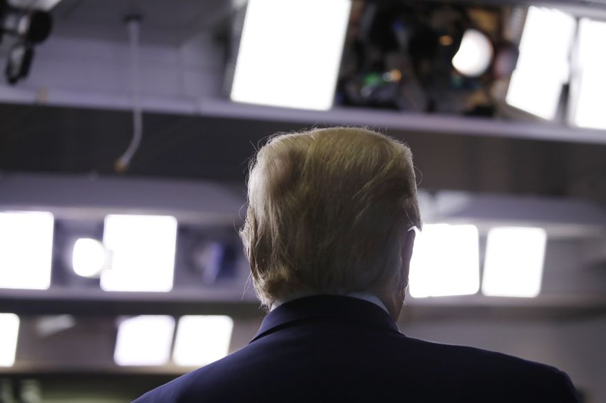 President Donald Trump listens during a briefing about the coronavirus in the James Brady Press Briefing Room of the White House, Monday, April 20, 2020, in Washington. (AP Photo/Alex Brandon)