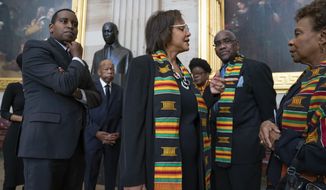 FILE - In this Oct. 24, 2019, file photo members of the Congressional Black Caucus gather for a memorial ceremony for the late Maryland Rep. Elijah Cummings, at the Capitol in Washington. From left are Rep. Joe Neguse, D-Colo., Rep. John Lewis, D-Ga., Rep. Robin Kelly, D-Ill., Rep. Gwen Moore, D-Wis., Rep. Gregory Meeks, D-N.Y., and Rep. Barbara Lee, D-Calif. The Congressional Black Caucus PAC is endorsing Joe Biden’s presidential bid, further cementing his support among the nation’s influential black political leadership. Black voters have long anchored the former vice president’s White House bid with decisive wins in South Carolina and on Super Tuesday. The chairman of the Congressional Black Caucus political action committee is New York congressman Gregory Meeks, who tells The Associated Press there’s “no question” Biden is the right person to lead the country.(AP Photo/J. Scott Applewhite, File)
