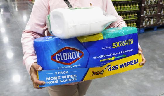 In this March 12, 2020, photo, a Costco customer buys cleaning supplies in Ridgeland, Miss. Reports of accidental poisonings from cleaners and disinfectants are up sharply, and researchers believe it&#39;s related to the coronavirus epidemic. Such poisonings were up about 20 percent in the first three months of this year, compared to the same periods in 2018 and 2019.. The Centers for Disease Control and Prevention released the report Monday, April 20. (AP Photo/Rogelio V. Solis) **FILE**