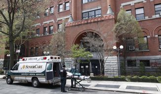 Emergency medical workers arrive at Cobble Hill Health Center, Friday, April 17, 2020, in the Brooklyn borough of New York. The despair wrought on nursing homes by the coronavirus was laid bare Friday in a state survey identifying numerous New York facilities where multiple patients have died. (AP Photo/John Minchillo)
