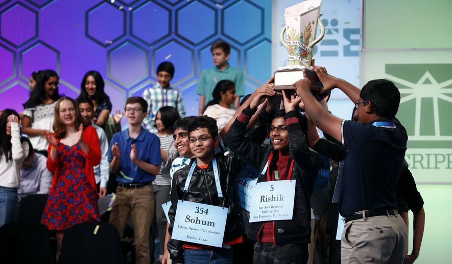 FILE - In this May 31, 2019 file photos, eight co-champions celebrate after winning the Scripps National Spelling Bee, in Oxon Hill, Md. The Scripps National Spelling Bee has been canceled after organizers concluded there was “no clear path to safely set a new date in 2020” because of the coronavirus pandemic. (AP Photo/Patrick Semansky)