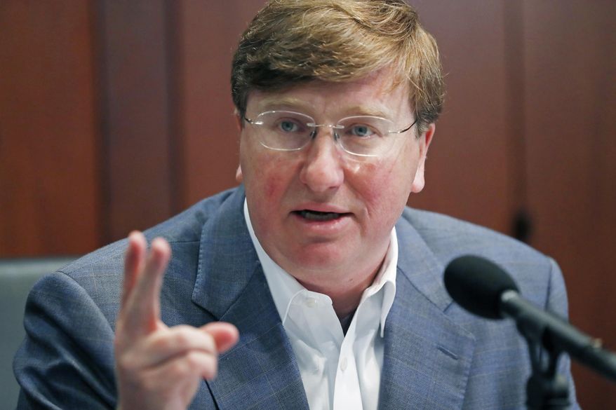 Mississippi Gov. Tate Reeves discusses how the state is responding to the continuing growth of unemployment demands and assistance for self-employed, church employees, gig workers, and others who were previously ineligible for unemployment assistance, during his afternoon news conference in Jackson, Miss., Tuesday, April 21, 2020. Reeves also discussed the continued development in the state's dealing with COVID-19. (AP Photo/Rogelio V. Solis)